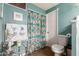Bathroom with shower/tub combo and teal accents at 8257 E Dutchman Dr, Mesa, AZ 85208