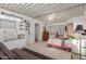 Bright bedroom with a flamingo-themed bedspread and built-in shelving at 8257 E Dutchman Dr, Mesa, AZ 85208