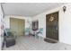 Inviting front porch with seating area and decorative wreath at 8257 E Dutchman Dr, Mesa, AZ 85208