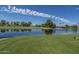 Scenic golf course view with pond and lush landscaping at 8257 E Dutchman Dr, Mesa, AZ 85208