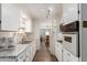 Efficient kitchen featuring granite countertops and stainless steel appliances at 8257 E Dutchman Dr, Mesa, AZ 85208