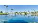Tranquil lake view with fountain and palm trees at 8257 E Dutchman Dr, Mesa, AZ 85208