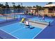 Active pickleball game in progress near the lake at 8257 E Dutchman Dr, Mesa, AZ 85208