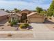 Single-story home with two-car garage and desert landscaping at 109 S Agua Fria Ln, Casa Grande, AZ 85194