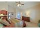 Comfortable bedroom with a king bed and built-in shelving at 109 S Agua Fria Ln, Casa Grande, AZ 85194