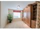 Bedroom with built-in Murphy bed and shelving unit at 109 S Agua Fria Ln, Casa Grande, AZ 85194