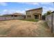 Artificial turf backyard with block wall and view of home's back at 4042 W Kirkland Ave, San Tan Valley, AZ 85144