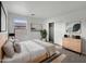 Bright bedroom with a queen bed, dresser, and large closet at 4042 W Kirkland Ave, San Tan Valley, AZ 85144