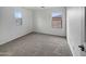 Bright bedroom with carpet and two windows at 4042 W Kirkland Ave, San Tan Valley, AZ 85144