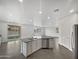 Modern kitchen with a large island and stainless steel appliances at 4042 W Kirkland Ave, San Tan Valley, AZ 85144