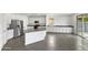 Modern kitchen with white cabinets, granite countertops, and stainless steel appliances at 4042 W Kirkland Ave, San Tan Valley, AZ 85144