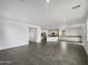 Open concept kitchen with island and dark flooring at 4042 W Kirkland Ave, San Tan Valley, AZ 85144
