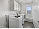 Laundry room with washer, dryer, and cabinets at 4042 W Kirkland Ave, San Tan Valley, AZ 85144