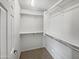 Spacious walk-in closet with shelves and rods at 4042 W Kirkland Ave, San Tan Valley, AZ 85144