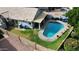 Inviting backyard oasis featuring a sparkling pool, grassy area, and covered patio at 4112 E Tanglewood Dr, Phoenix, AZ 85048