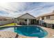 Stunning pool area with a large kidney shaped pool and spacious patio at 4112 E Tanglewood Dr, Phoenix, AZ 85048