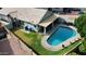 Inviting backyard oasis featuring a sparkling pool, grassy area, and covered patio at 4112 E Tanglewood Dr, Phoenix, AZ 85048