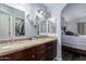 Bathroom with double sinks, granite countertop, and view of bedroom at 4112 E Tanglewood Dr, Phoenix, AZ 85048