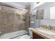 Bathroom with shower/tub combo, tile surround, and granite vanity at 4112 E Tanglewood Dr, Phoenix, AZ 85048