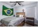 Bedroom with wooden headboard and ceiling fan at 4112 E Tanglewood Dr, Phoenix, AZ 85048