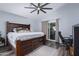 Main bedroom with king-size bed, ceiling fan, and access to backyard at 4112 E Tanglewood Dr, Phoenix, AZ 85048