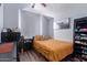 Bedroom with mustard-colored bedding, and a ceiling fan at 4112 E Tanglewood Dr, Phoenix, AZ 85048