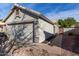 House exterior featuring a two-car garage and a walkway at 4112 E Tanglewood Dr, Phoenix, AZ 85048