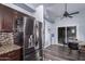 Kitchen features dark cabinetry, granite counters, and stainless steel appliances at 4112 E Tanglewood Dr, Phoenix, AZ 85048