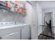 Laundry room with washer, dryer, and shelving at 4112 E Tanglewood Dr, Phoenix, AZ 85048