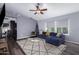 Bright and airy living room with dark hardwood floors and a ceiling fan at 4112 E Tanglewood Dr, Phoenix, AZ 85048