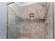 Shower with glass enclosure and tile surround at 4112 E Tanglewood Dr, Phoenix, AZ 85048