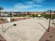 Full-size outdoor basketball court with lighting at 1032 W Finch Dr, Queen Creek, AZ 85140