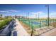 Outdoor pickleball courts with seating and shade structures at 1032 W Finch Dr, Queen Creek, AZ 85140