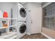 Laundry room with stackable washer and dryer at 1392 W Kesler Ln, Chandler, AZ 85224