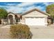 Charming single-story home with two-car garage and well-manicured landscaping at 15016 W Honeysuckle Ln, Surprise, AZ 85374