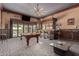 Game room with pool table, bar, and view of pool at 18208 W Happy Valley Rd, Wittmann, AZ 85361