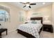 Bedroom with ceiling fan, window, and double bed at 21682 N 266Th Ave, Buckeye, AZ 85396