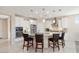 Large kitchen island with seating and granite countertops at 21682 N 266Th Ave, Buckeye, AZ 85396