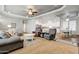 Spacious living room with gray sofas, armchairs, and a coffee table at 234 S 73Rd Way, Mesa, AZ 85208