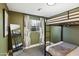 Bedroom with a full-over-full bunk bed and cactus print curtains at 2401 N 37Th St, Phoenix, AZ 85008