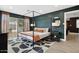 Spacious primary bedroom with a king-size bed and access to a private patio at 2401 N 37Th St, Phoenix, AZ 85008