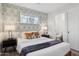 Cozy bedroom featuring a full-size bed and patterned wallpaper at 2401 N 37Th St, Phoenix, AZ 85008