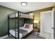 Charming bedroom with a full-over-full bunk bed and green walls at 2401 N 37Th St, Phoenix, AZ 85008
