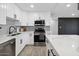 Sleek kitchen featuring white shaker cabinets and a quartz countertop at 2401 N 37Th St, Phoenix, AZ 85008