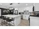 Modern kitchen with white cabinets, large island, and stainless steel appliances at 2401 N 37Th St, Phoenix, AZ 85008