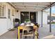 Outdoor patio with dining table, string lights, and grill at 2401 N 37Th St, Phoenix, AZ 85008