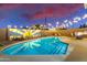 Stunning pool at dusk with artistic wall and lights at 2401 N 37Th St, Phoenix, AZ 85008