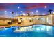 Expansive pool reflecting the home and evening sky at 2401 N 37Th St, Phoenix, AZ 85008