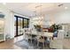 Bright dining room featuring a farmhouse table and chairs, with access to the backyard at 3815 E Berridge Ln, Paradise Valley, AZ 85253