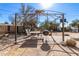 Backyard patio with pergola, grill, and seating at 411 N 111Th Pl, Mesa, AZ 85207